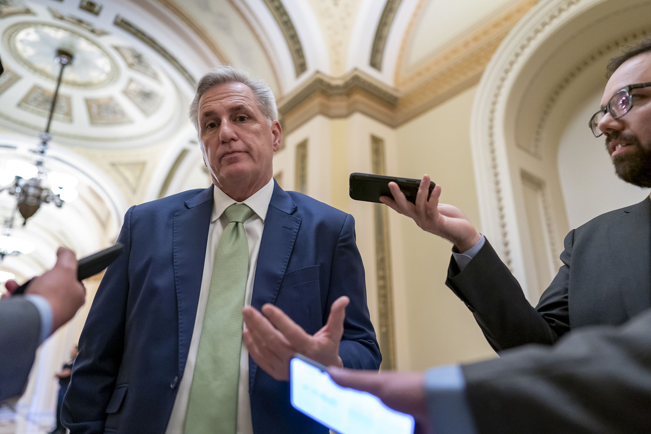 House Minority Leader Kevin McCarthy, R-Calif., talks to reporters as the House voted to hold former President Donald Trump advisers Peter Navarro and Dan Scavino in contempt of Congress over their monthslong refusal to comply with subpoenas from the committee investigating the Jan. 6 attack, at the Capitol in Washington, Wednesday, April 6, 2022. (AP Photo/J. Scott Applewhite)