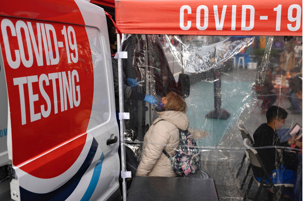 A person gets tested for COVID-19 at a mobile testing site in Times Square, New York (AP Photo/Yuki Iwamura)