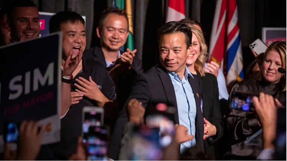 Ken Sim celebrates his win as the next mayor of Vancouver, marking the first time a person of colour has held the highest office in the city, on Saturday, Oct. 15, 2022. (Ben Nelms/CBC)