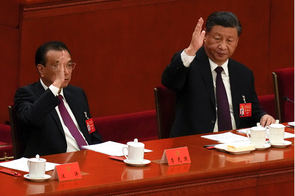 Chinese Premier Li Keqiang, left, and President Xi Jinping vote at the closing ceremony of the 20th National Congress of China's ruling Communist Party at the Great Hall of the People in Beijing, Saturday, Oct. 22 Photo: Andy Wong/ AP Photo