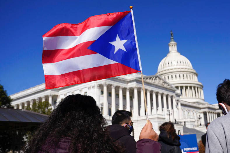 A Puerto Rican flag is waved outside the US Capitol